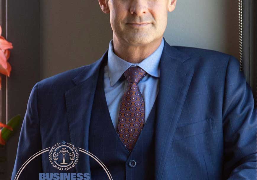 Patrick McCroskey included in the 2020 Legal Elite Patrick McCroskey in his office in Asheville with the 2020 Legal Elite Logo in the bottom left corner.