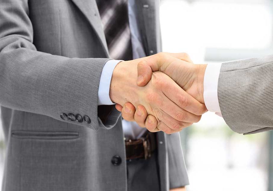 Agreement Image of two men shaking hands in agreement.