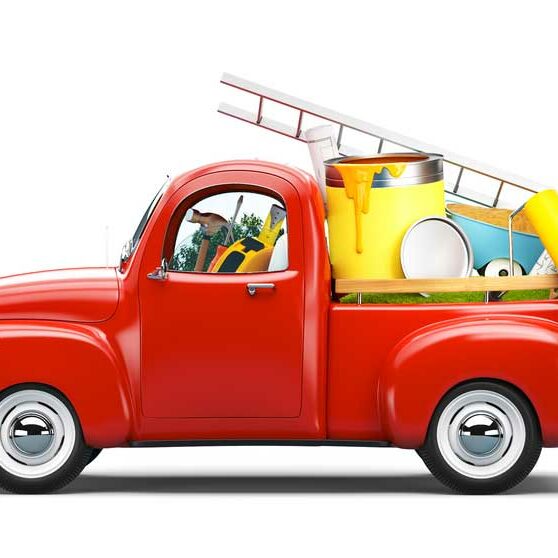 Image of a toy, possibly a model, of a bright red antique truck filled with colorful tools depicting the idea of property belonging to a family that might be titled by a business or third party