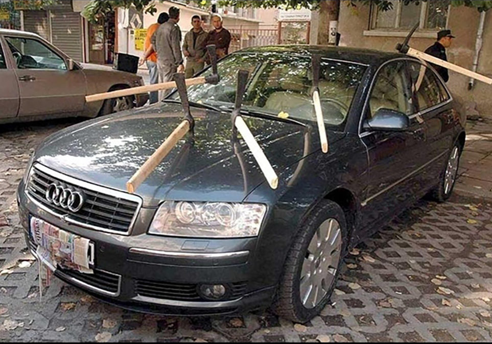 Revenge Image of an Audi sedan with six pick axes stuck into it depicting revenge in divorce. Ouch.