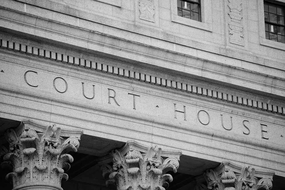 Image of the facade of an ornate courthouse