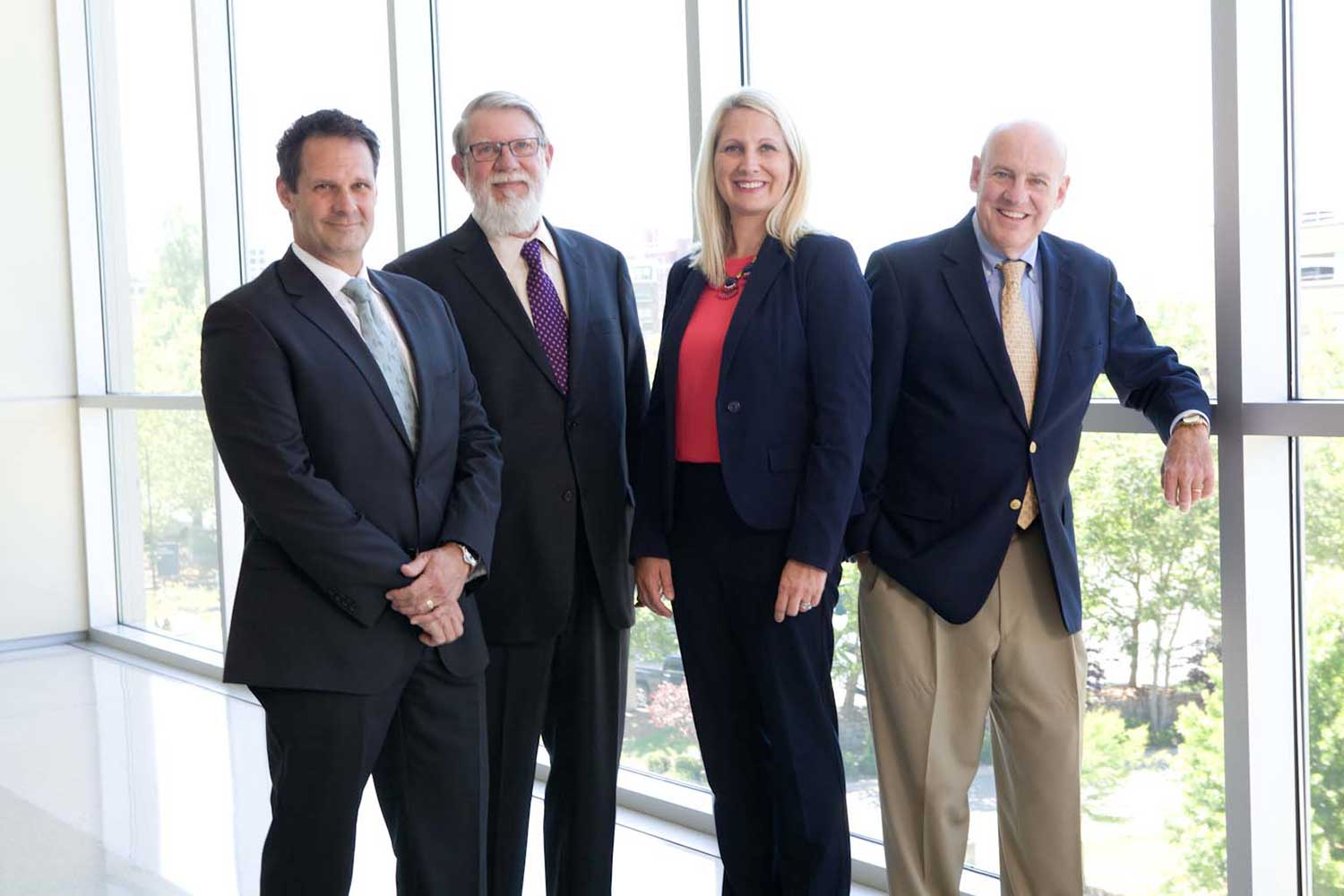 Image of Attorneys Patrick McCroskey, Howard Gum, Janet Amburgey, and David Hillier taken on location at the Buncombe County Justice Center in 2017