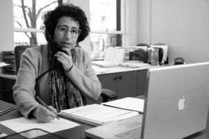 Black and White image of Idelle David in her office at 47 North Market Street.