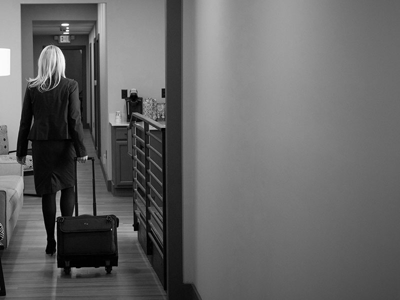 Strategies for Family Law | Image depicts Asheville Divorce & Family Law Partner with trial bag moving through the office.