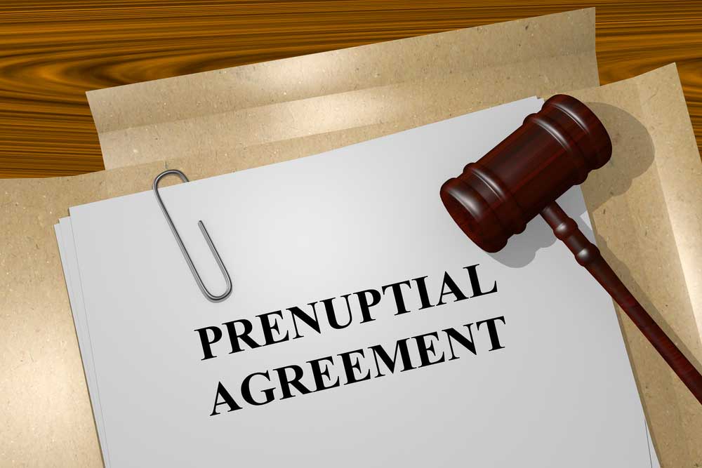 Image of a file folder attoped with a gavel labeled Prenuptial Agreement.