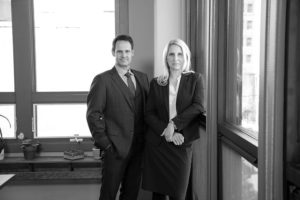 Black and white image of Patrick McCroskey and Janet Amburgey in their offices at the historic 47 North Market Street Building.