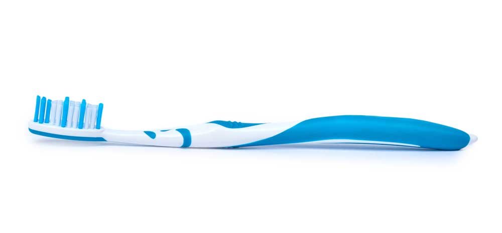 Image of a single toothbrush on a white field depicting the idea of separate personal property.