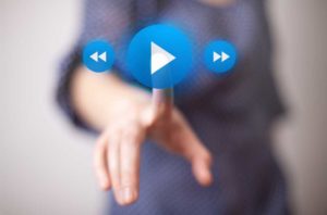 Image depicting playing a video with play button, rewind and fast forward.